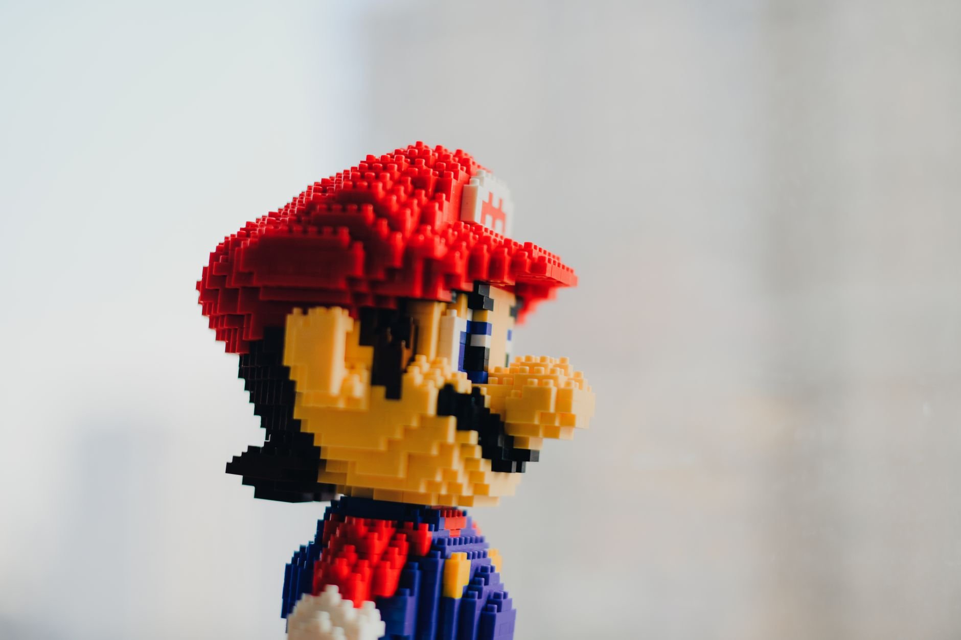 A detailed close-up of pixel art built from colorful building blocks